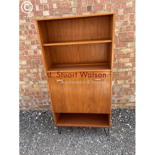 12 - A g Plan mid century cocktail cabinet with drop down front and fitted with internal mirror glass com... 