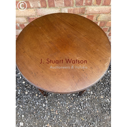 26 - An ornate circular Mahogany occasional table