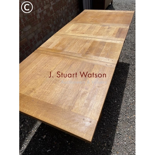 30 - A light oak extending dining table with two leaves 217x90 (maximum size )