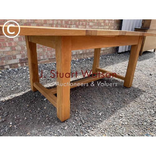 30 - A light oak extending dining table with two leaves 217x90 (maximum size )