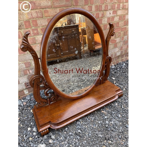 4 - A large Victorian mahogany swing mirror