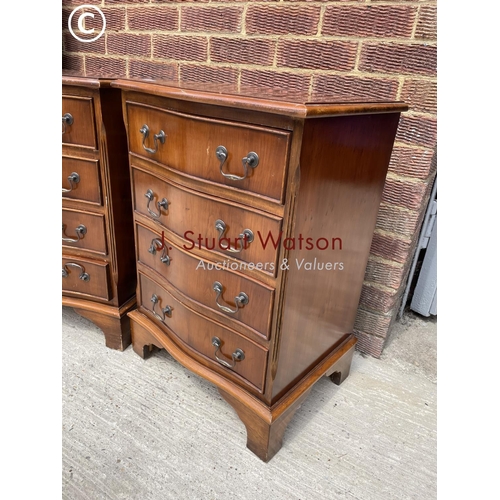 53 - A pair of reproduction yew chests of four drawers