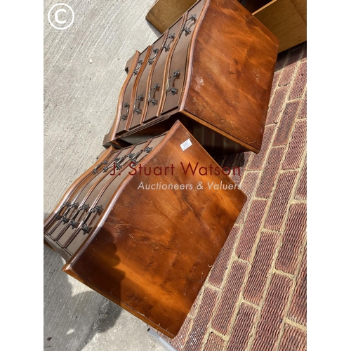 53 - A pair of reproduction yew chests of four drawers