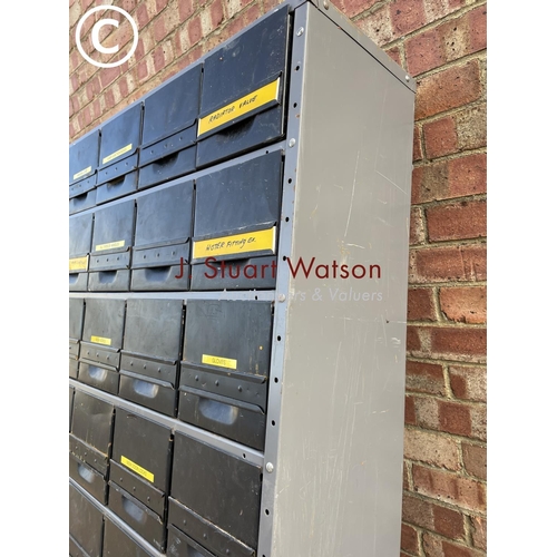 256 - A large industrial bank of Dexion housing 36 parts drawers 90x30x192