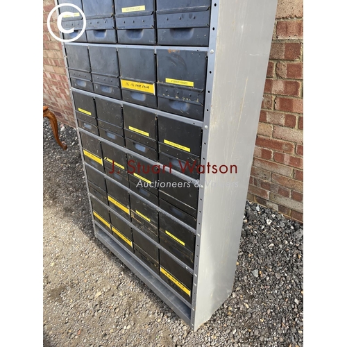 256 - A large industrial bank of Dexion housing 36 parts drawers 90x30x192