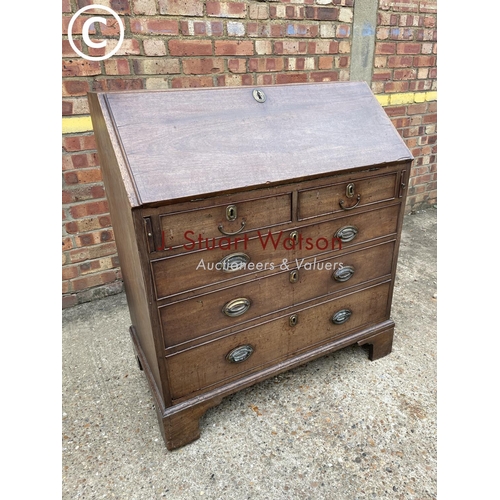 259 - A Victorian mahogany bureau with fitted interior (one leg af)