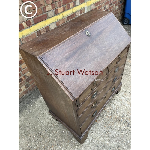 259 - A Victorian mahogany bureau with fitted interior (one leg af)