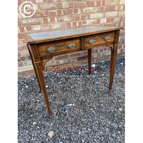 105 - A Victorian rosewood two drawer writing table with a blue leather top