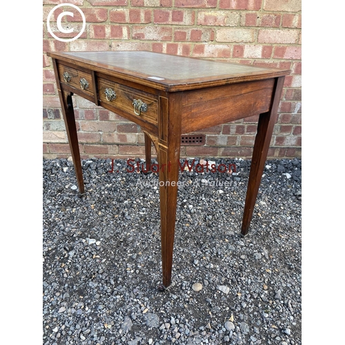 105 - A Victorian rosewood two drawer writing table with a blue leather top