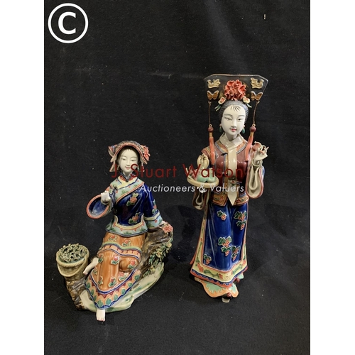 1057 - Two Oriental lady figures both with damage to fingers, height of tallest 30 cms