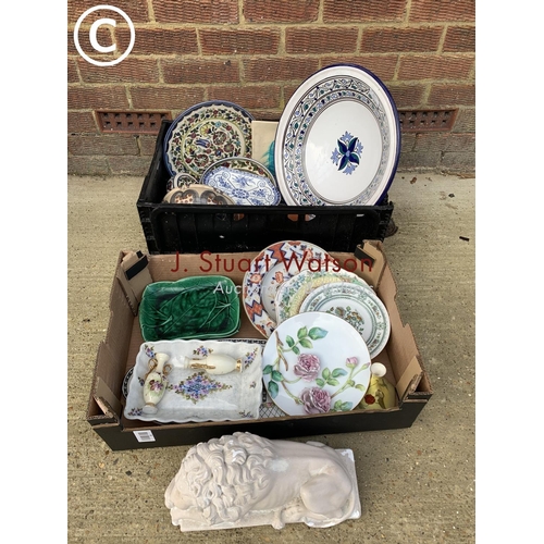 1063 - Two boxes of colourful pottery and china