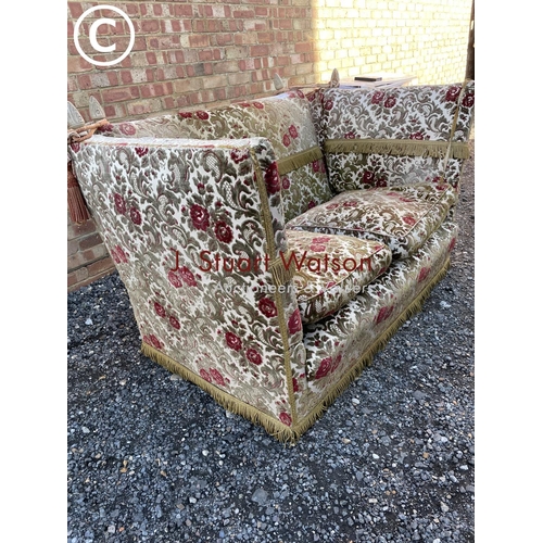 109 - A red and gold pattern Knoll drop end sofa