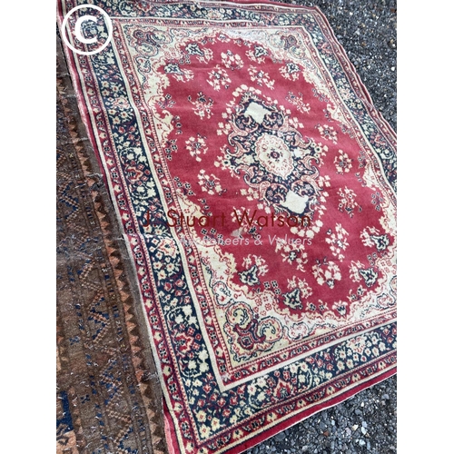 117 - Two worn Oriental style rugs