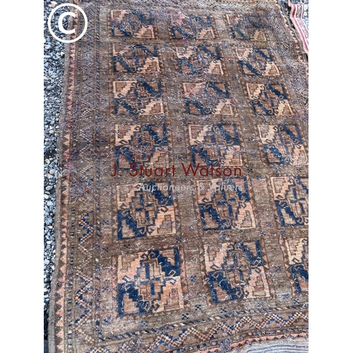 117 - Two worn Oriental style rugs