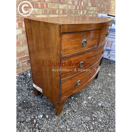 122 - A Victorian mahogany bow front chest of four drawers