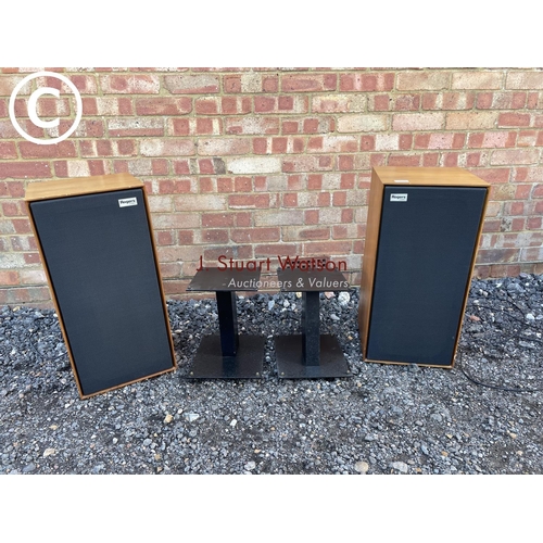 133 - A pair of teak cased Rogers studio 1 speakers with stands