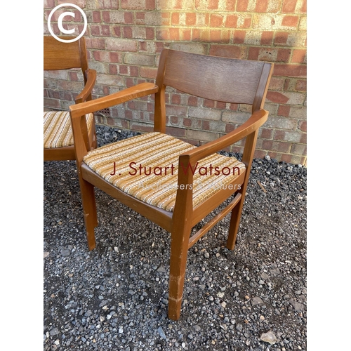 134 - A pair of danish style teak carver chairs