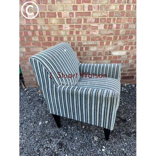 137 - A modern striped armchair from next