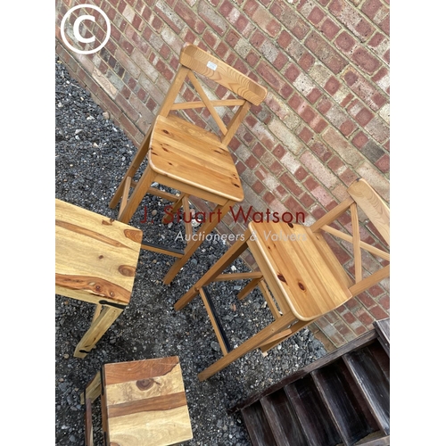 139 - A pair of pine stools together with 2 occasional tables and a cd rack