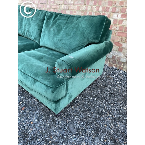 144 - A modern green velvet sofa