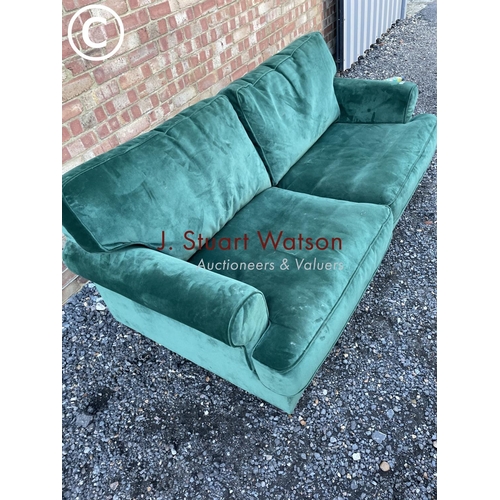 144 - A modern green velvet sofa