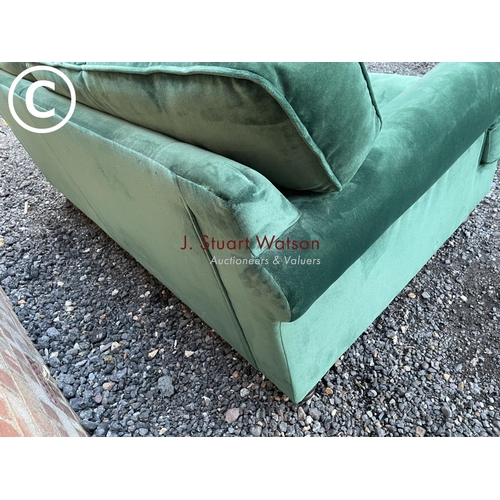 144 - A modern green velvet sofa