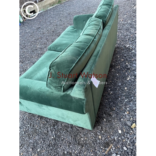 144 - A modern green velvet sofa