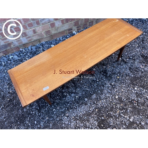 153 - A teak coffee table