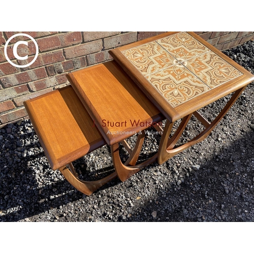 16 - A g Plan teak nest of three tables with a tiled top to the larger table