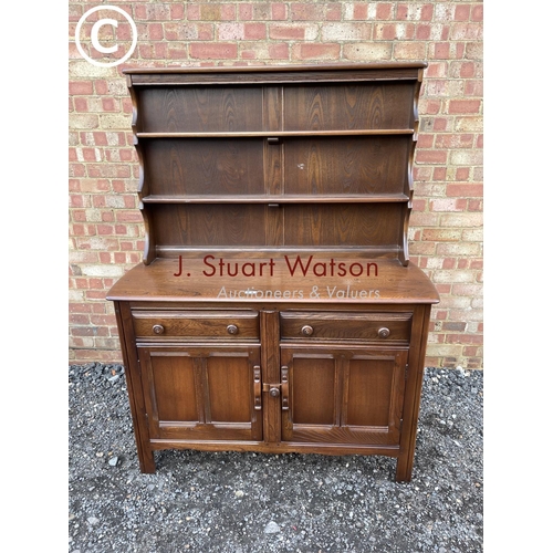 160 - A dark Ercol cottage dresser