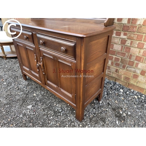 160 - A dark Ercol cottage dresser