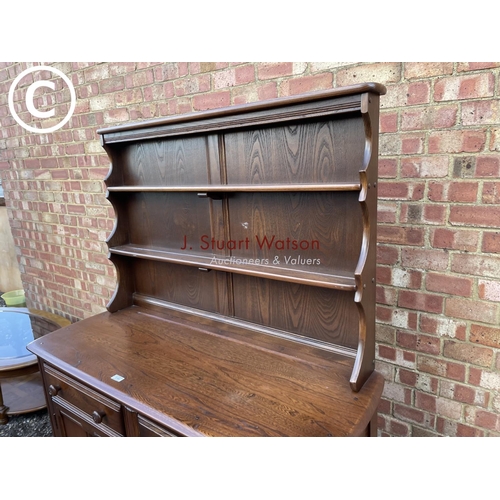 160 - A dark Ercol cottage dresser