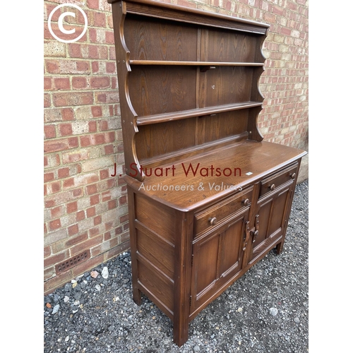 160 - A dark Ercol cottage dresser