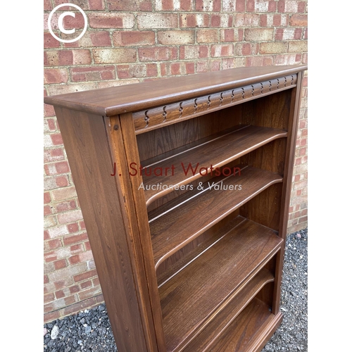 161 - An Ercol golden dawn open fronted bookcase