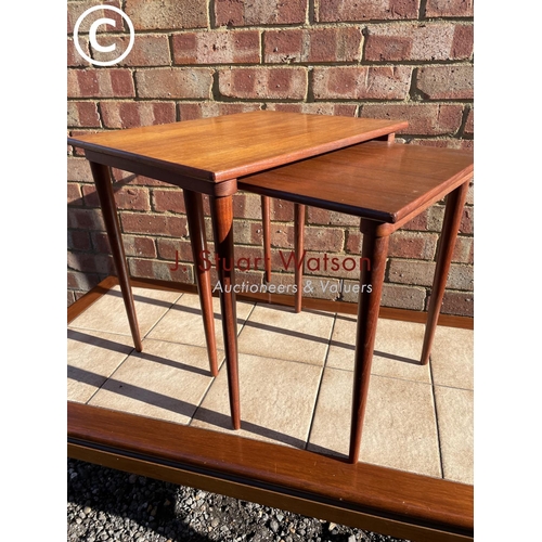 17 - A Danish style teak nest of two together with a teak tile top coffee table