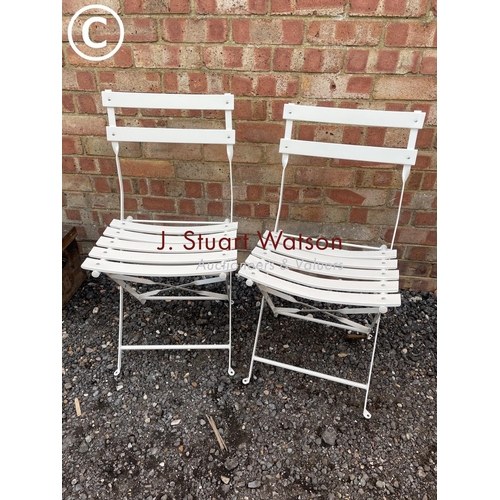 171 - A pair of metal folding chairs