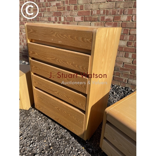 179 - A modern Danish bedroom suite consisting of a tallboy chest and two bedsides