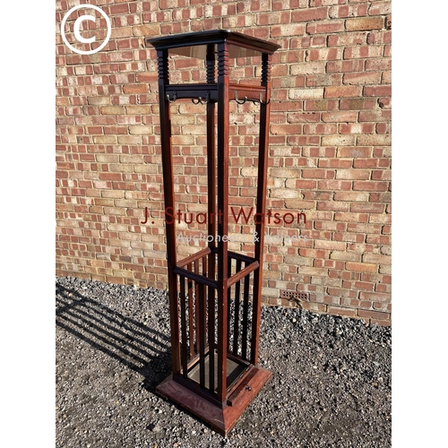 186 - An Edwardian mahogany hallstand of square form, stamped to the slide JAS SHOLBRED & CO