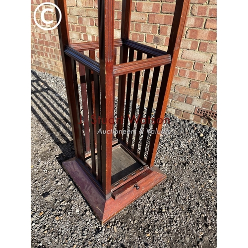 186 - An Edwardian mahogany hallstand of square form, stamped to the slide JAS SHOLBRED & CO