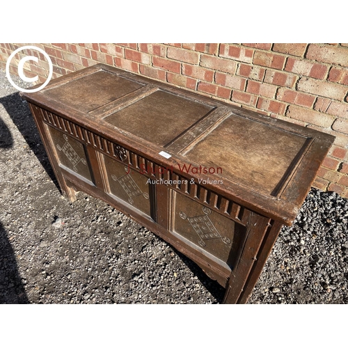 187 - An 17th century oak three panel blanket coffer