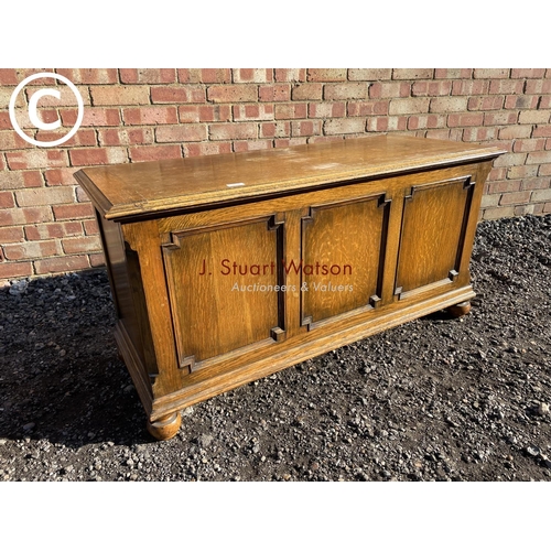 188 - A 20th century oak three panel blanket box by Fyne lodge