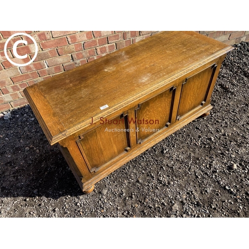 188 - A 20th century oak three panel blanket box by Fyne lodge