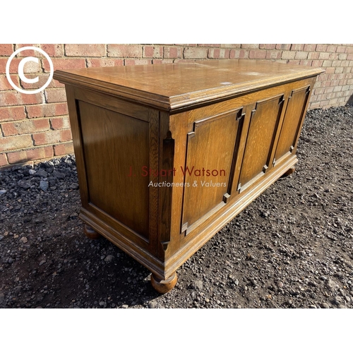 188 - A 20th century oak three panel blanket box by Fyne lodge