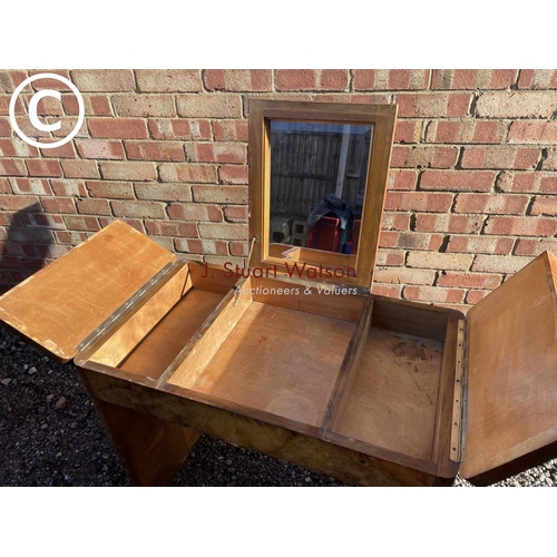 19 - An Art Deco style walnut vanity tabke with lift up mirror top