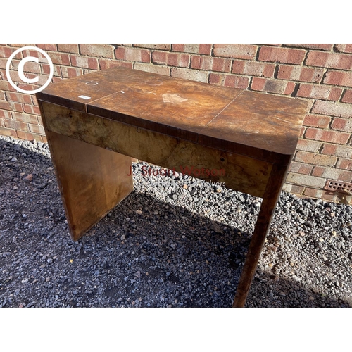 19 - An Art Deco style walnut vanity tabke with lift up mirror top