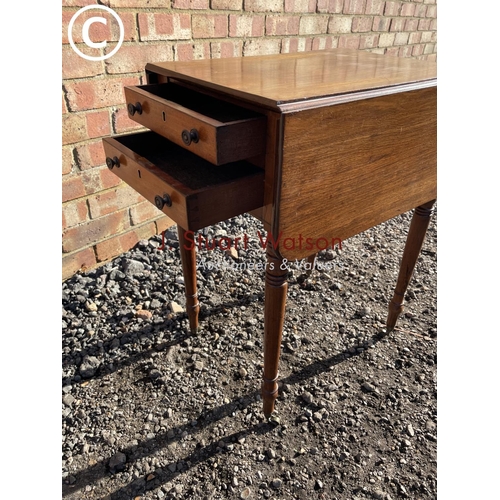 194 - A Victorian mahogany drop leaf work table with two drawers and two dummy drawers