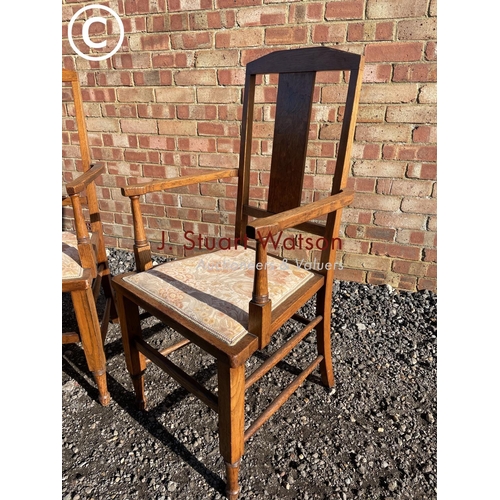 195 - A pair of arts and crafts style oak carver chairs