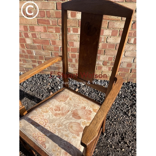 195 - A pair of arts and crafts style oak carver chairs