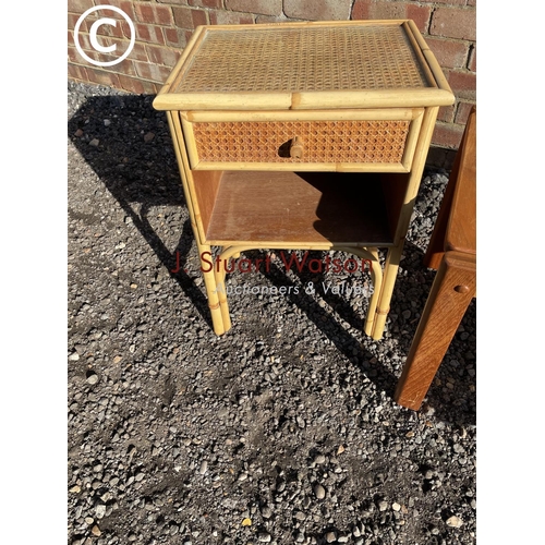 196 - A teak coffee table,together with a bamboo side table and a inlaid table