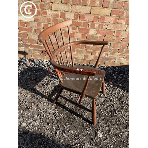 197 - An Ercol style stick back carver chair